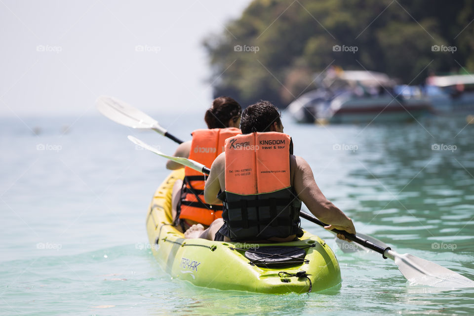 Tourist sailing Canoe boat in the sea