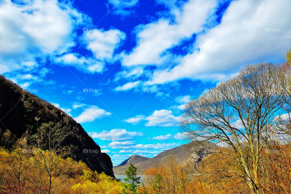 spring clouds mountains blue sky by delvec