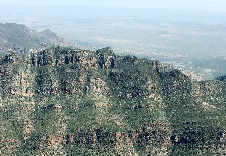 Scientists can tell a lot about the earth and its past through the formations and fossils found I. The Flinders Ranges, here an aerial view in Springtime 