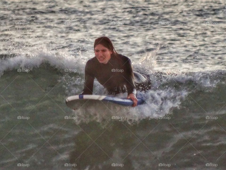 Surfer Girl Catching A Wave. California Surfer Girl
