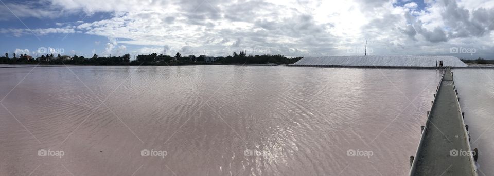 Pink salt water called Las Salinas in Cabo Rojo, Puerto Rico. The place harvest salt in great amounts.