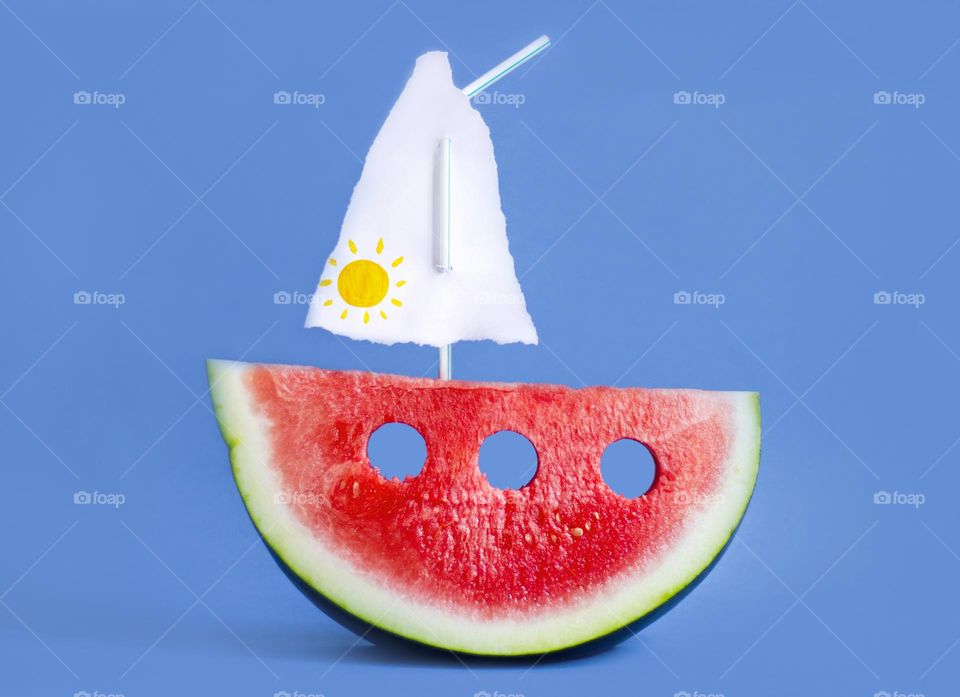 Half slice of a watermelon like a boat