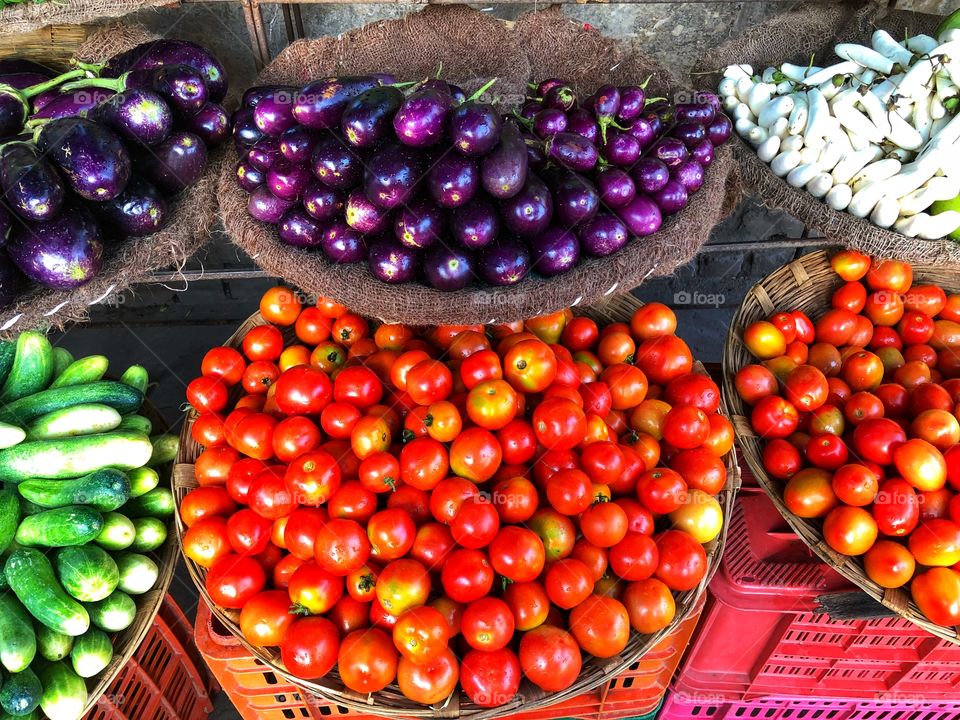 Fresh organic tomatoes and eggplant for sale at the farmer’s market!