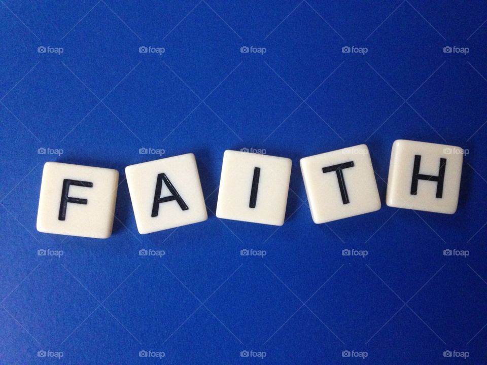Faith . Word faith made with tile letters