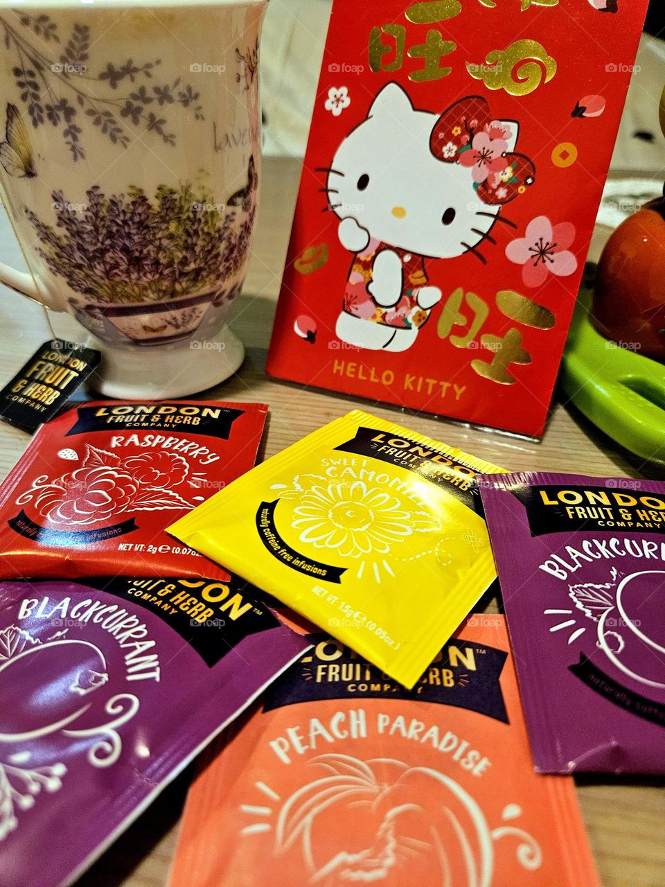 Colorful flower and fruit tea and red envelope persimmon joy