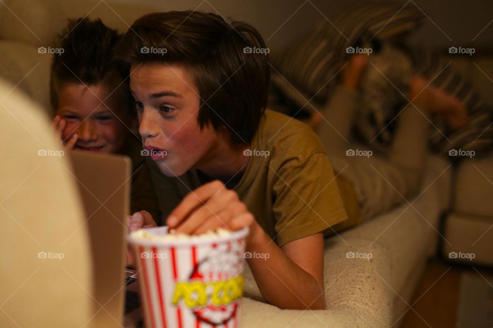 two brothers, at home, watching the oscar ceremony on the computer, oscar nomination