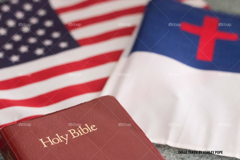 Bible with Christian Flag and American Flag. 