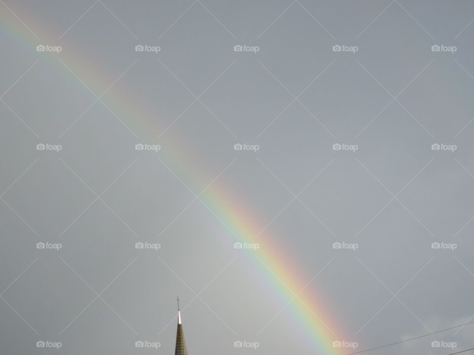 Summer Rainbow. A shot of a rainbow captured after a summer rain.