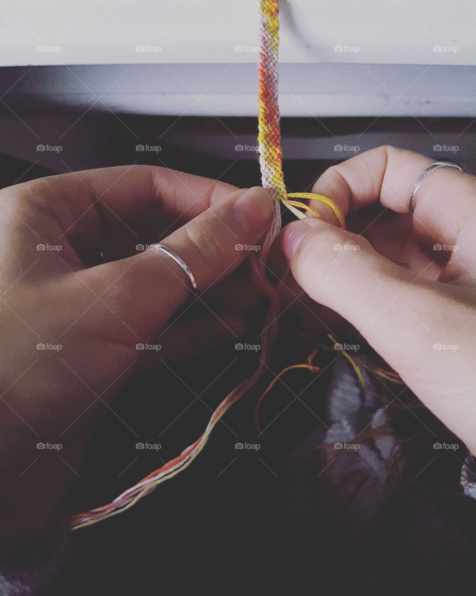 Working hands weaving bracelet