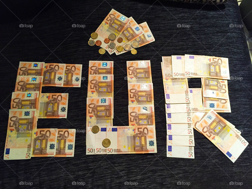 Write down Euro with 50 euros banknotes 