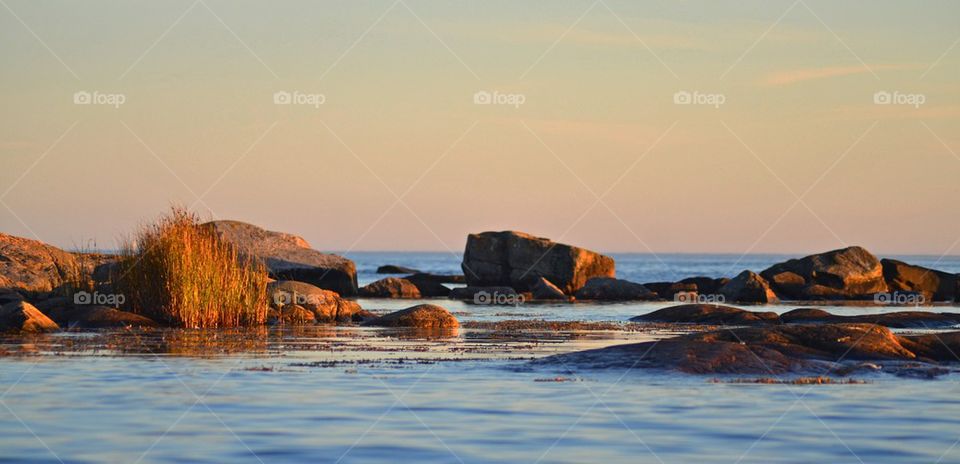 Tranquil sea at sunset