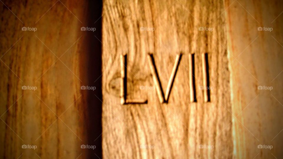 Roman Numeral LVII (57) engraved on Spanish Mission Door