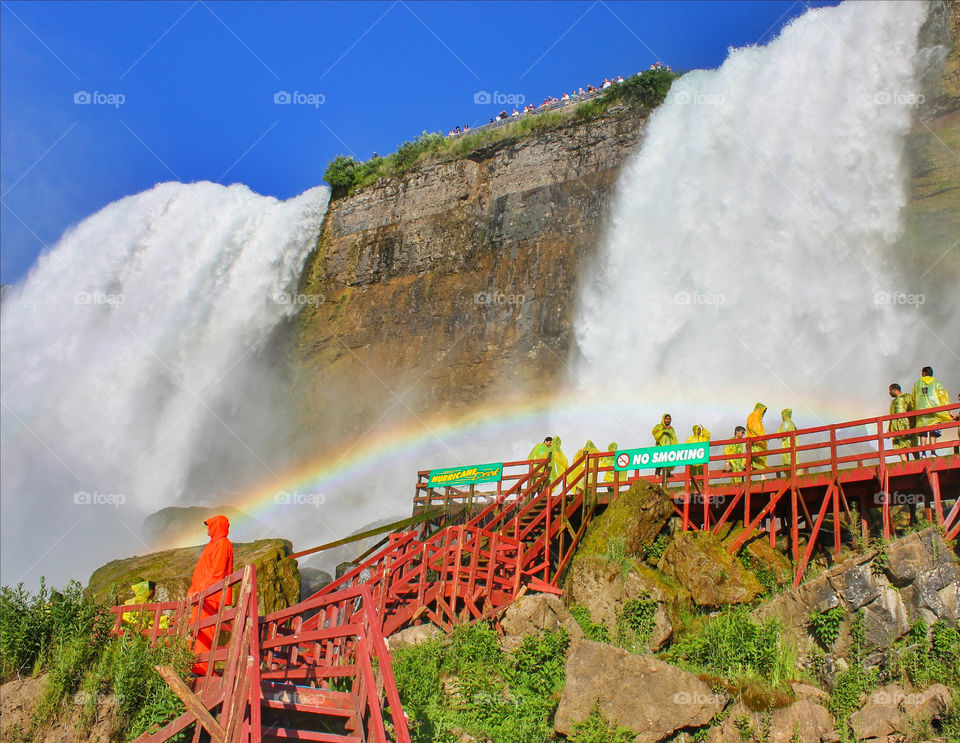 people and rainbow at Niagara falls