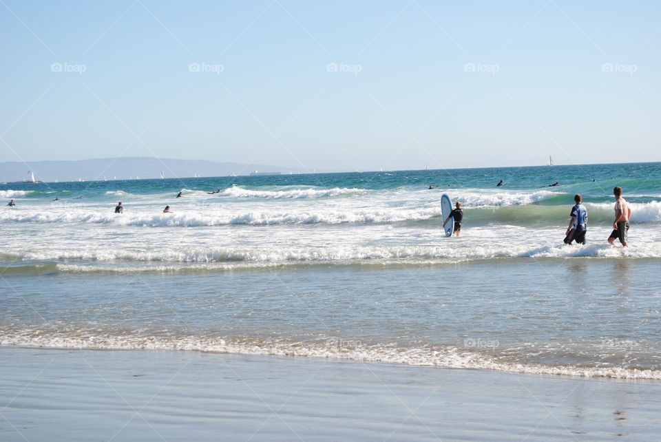 People in the water at the beach