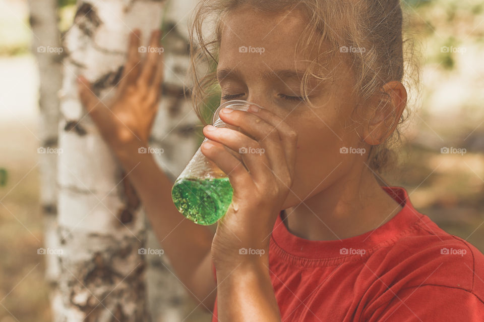 Strong thirst, girl drinking water