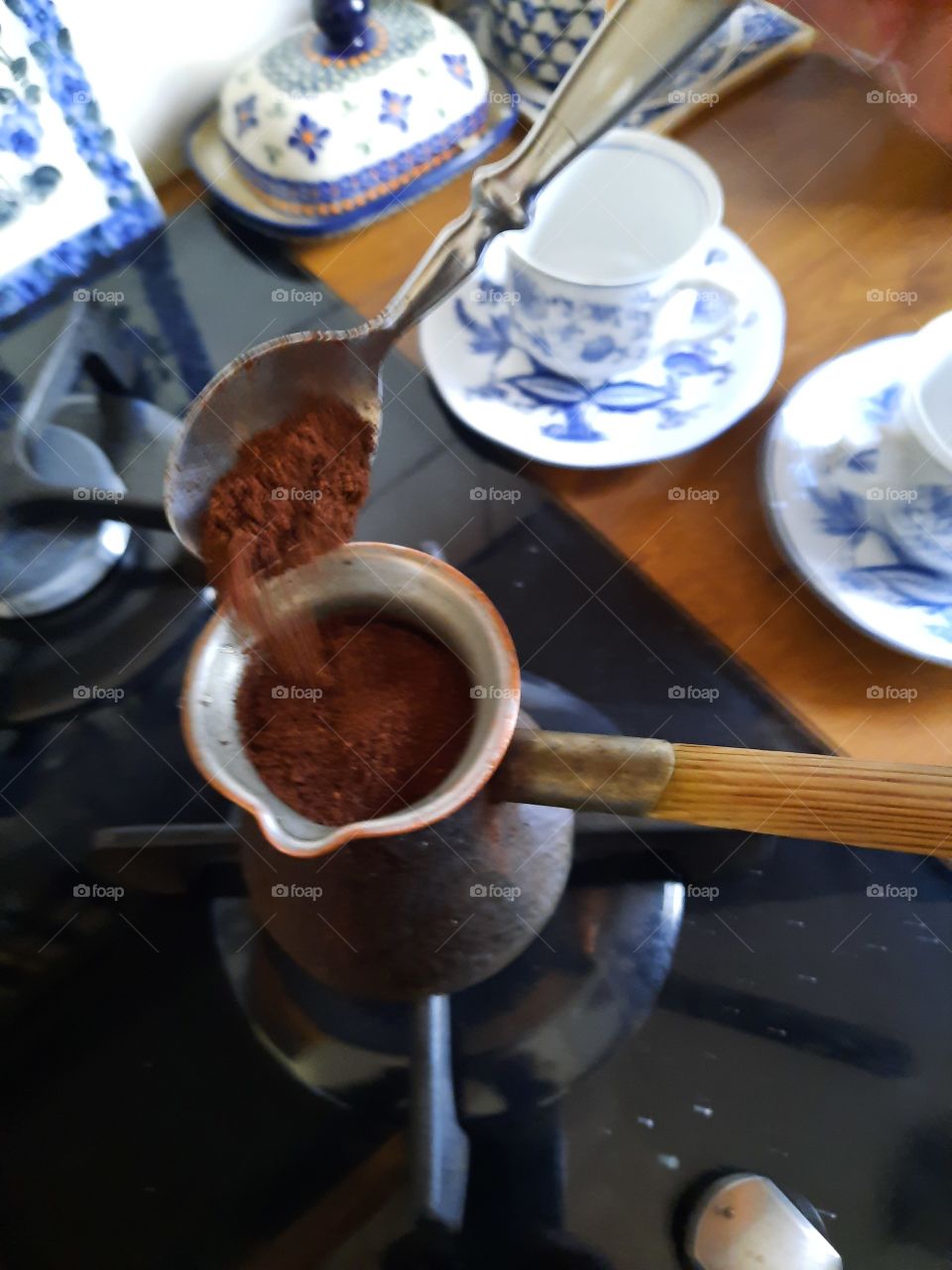 pouring coffee into the crucible