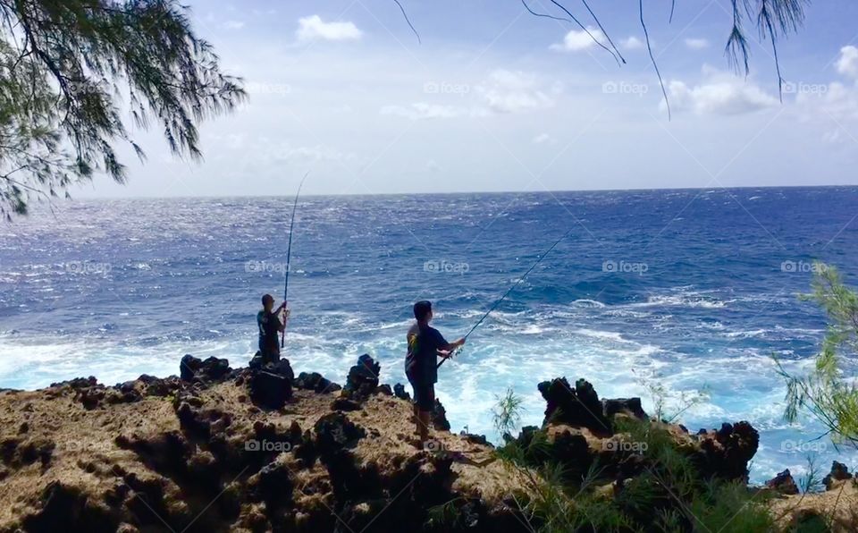 Fishermen on a sea cliff