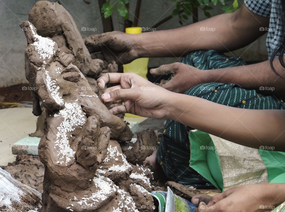 Crafts man working on a clay