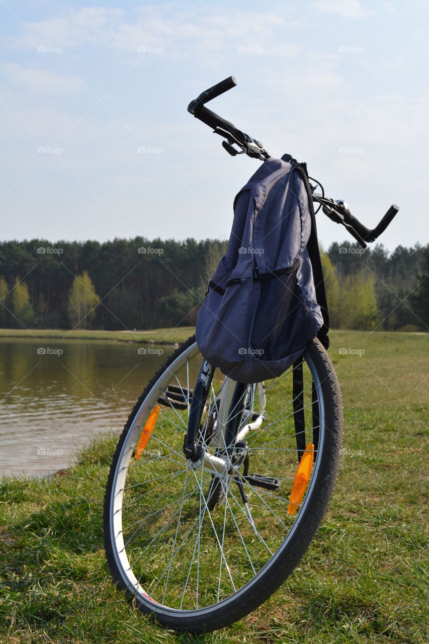 bike on a lake shore beautiful spring landscape blue sky background