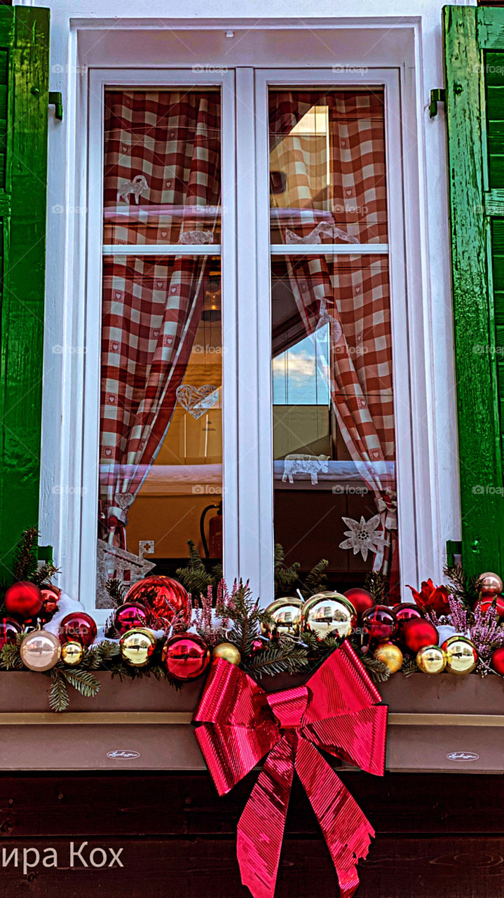 old house in Switzerland, windows, decorated house, New Year's house, New Year's toys, fairy house, icicles on the roof