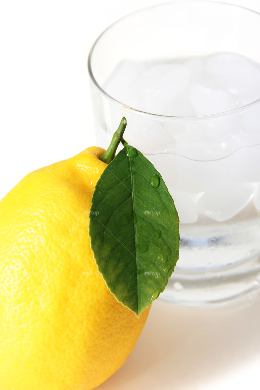 Lemon and glass ice water 