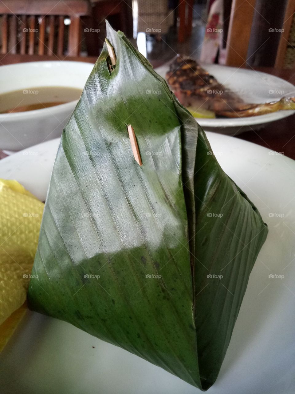 bu kulah ( nasi bungkus daun pisang)