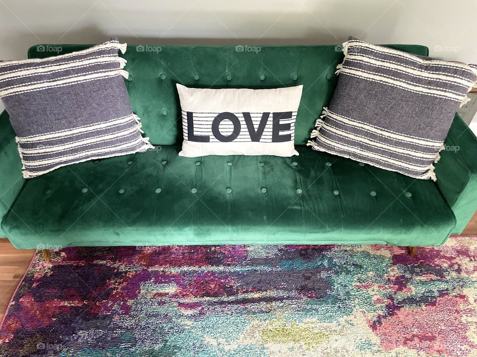 Green couch with love pillows, green velvet couch, couch from Wayfair, hipster couches, sitting on velvet couches 