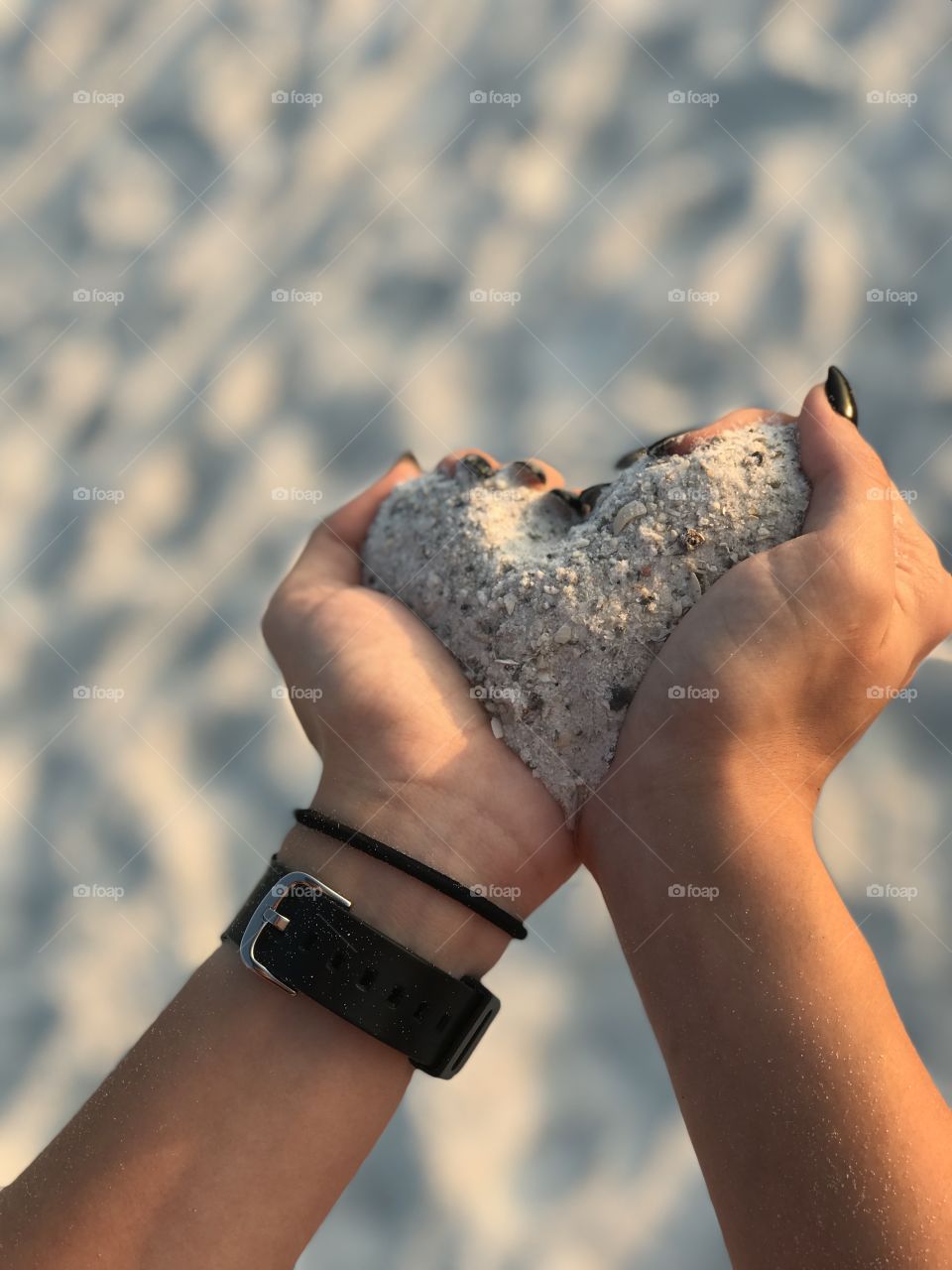 Heart shaped hands with sand 
Anna Maria Island, FL, USA