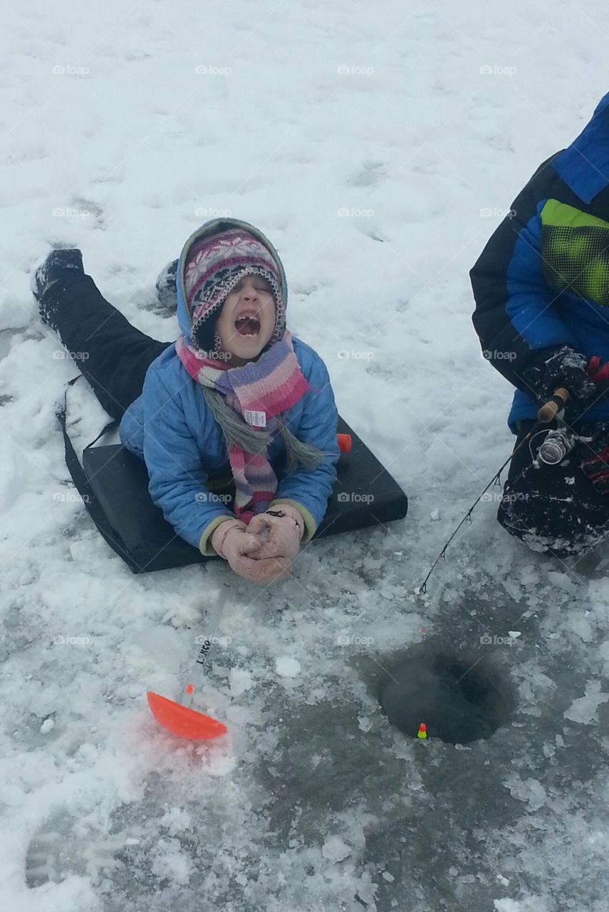 Ice fishing fun. My daughter ice fishing for school