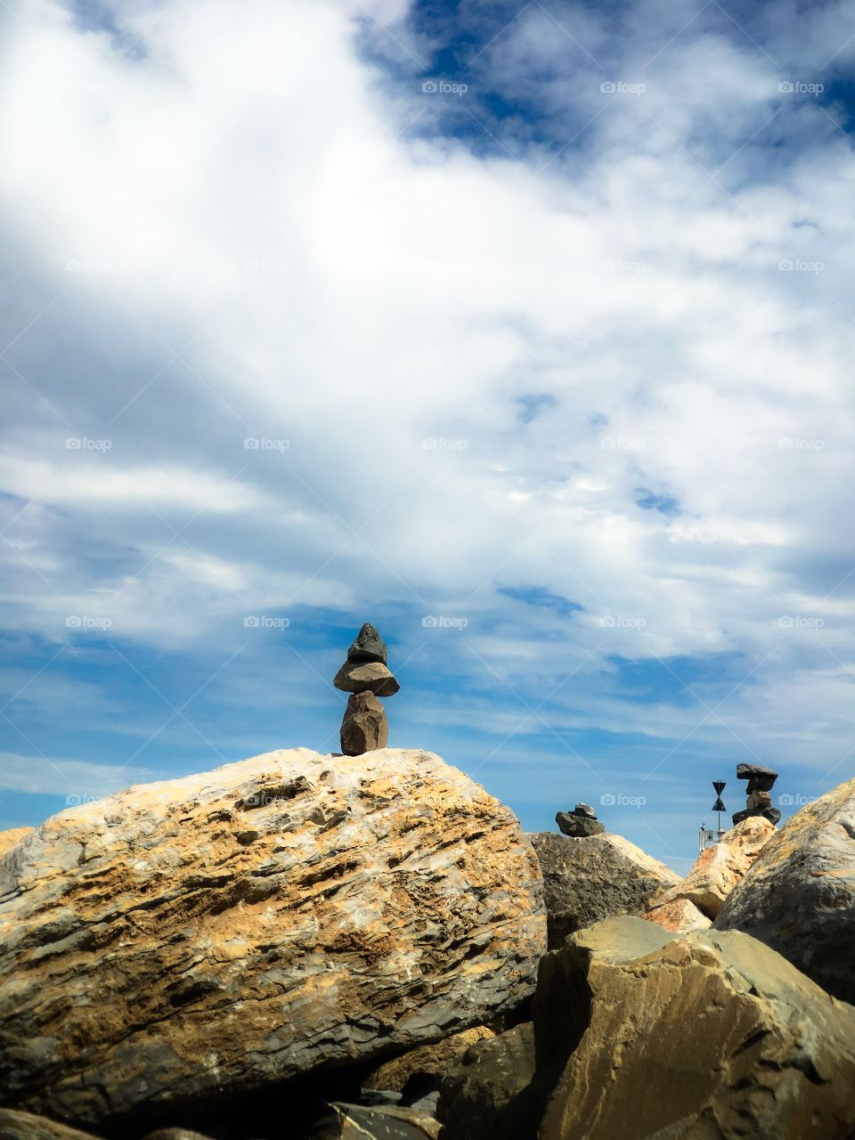 Stone stacking rock balancing ocean side 