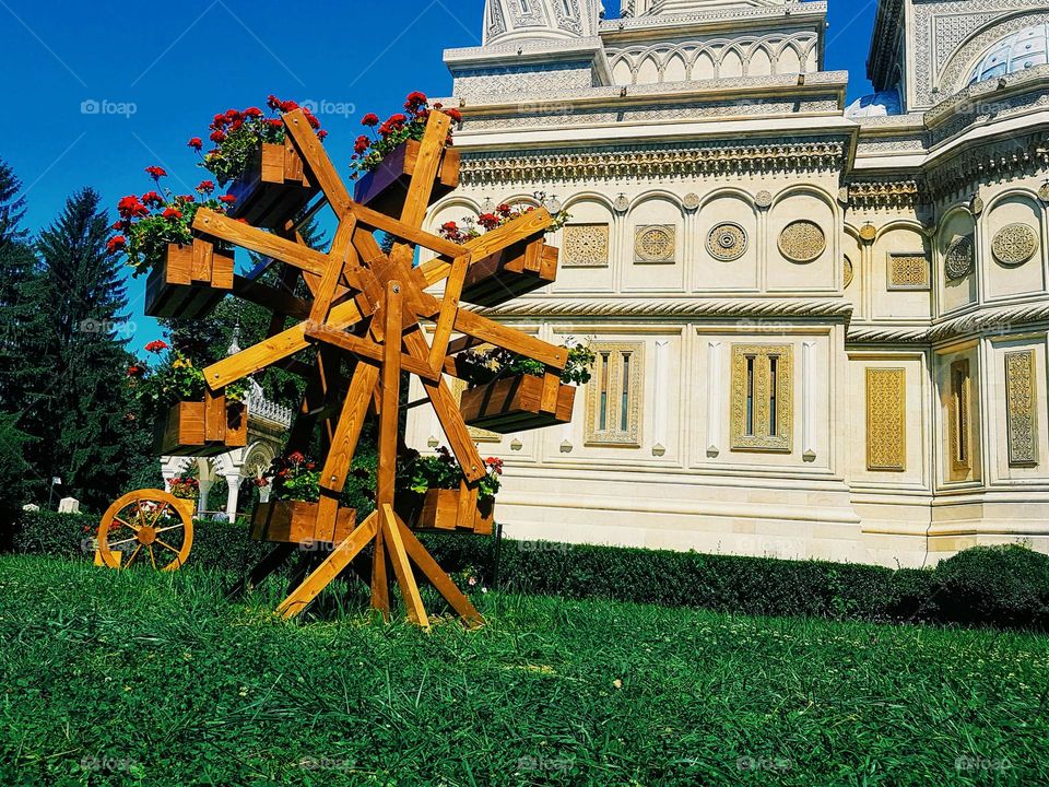 wooden windmill with flowers