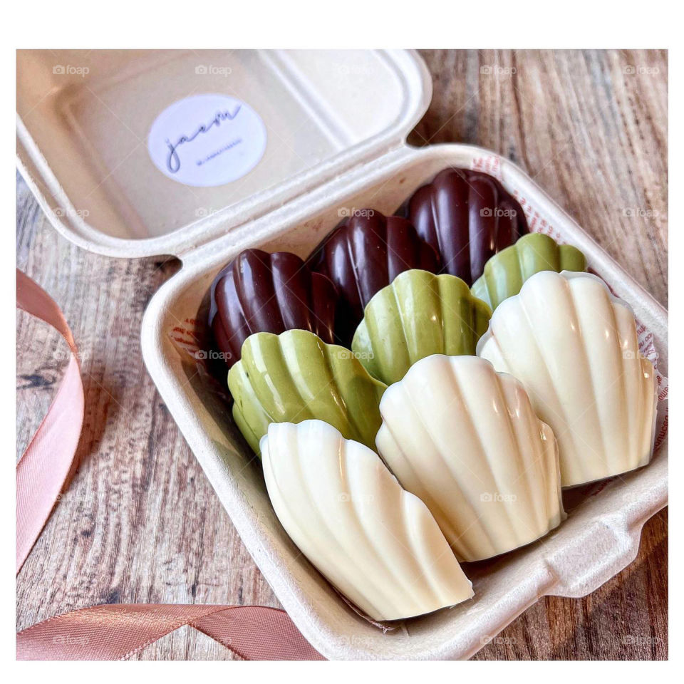 Chocolate coated shell-shaped madeleines for foodie
