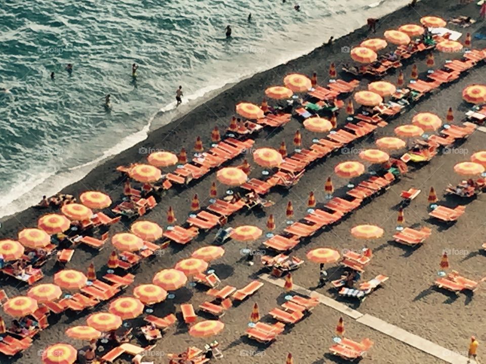 Little orange umbrella. Umbrellas in Amalfi. 