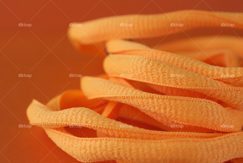 Close-up of orange colored nylon cord