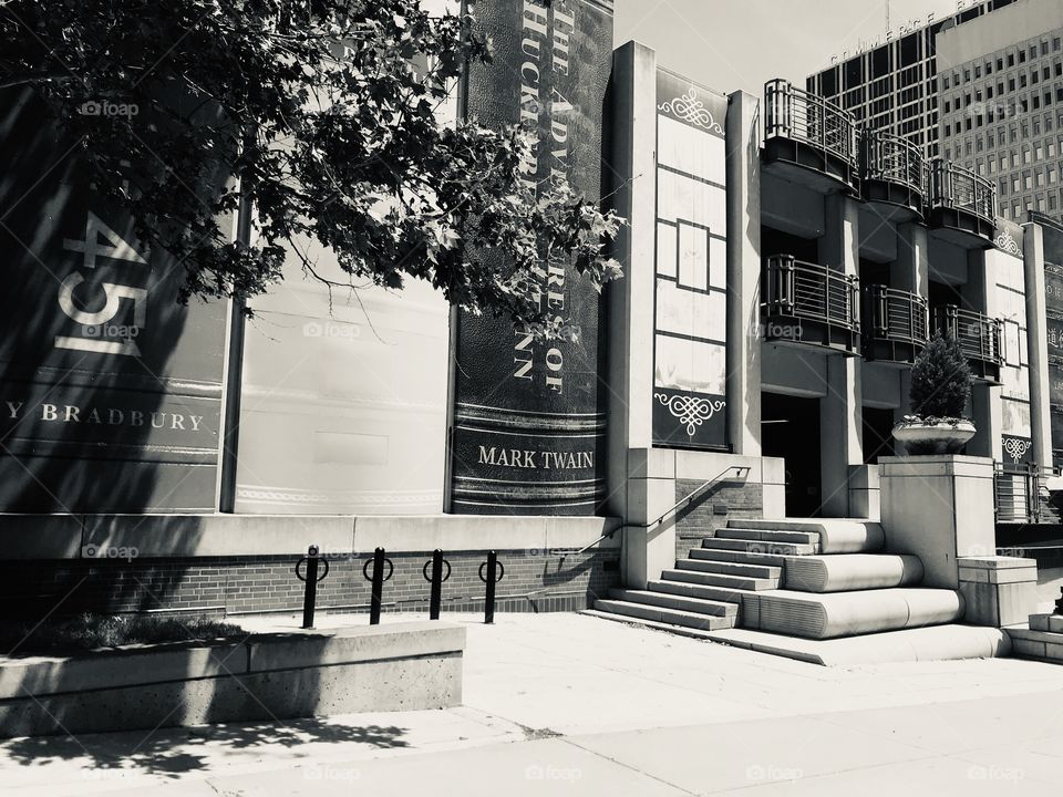 Amazing library building in Kansas City area designed to look like books lined up on a shelf with the steps to the building looking like books laid on their side!! Incredible design! 
