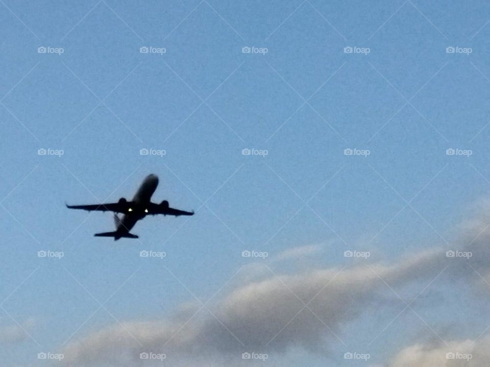 Beautiful airplane flying cross the sky