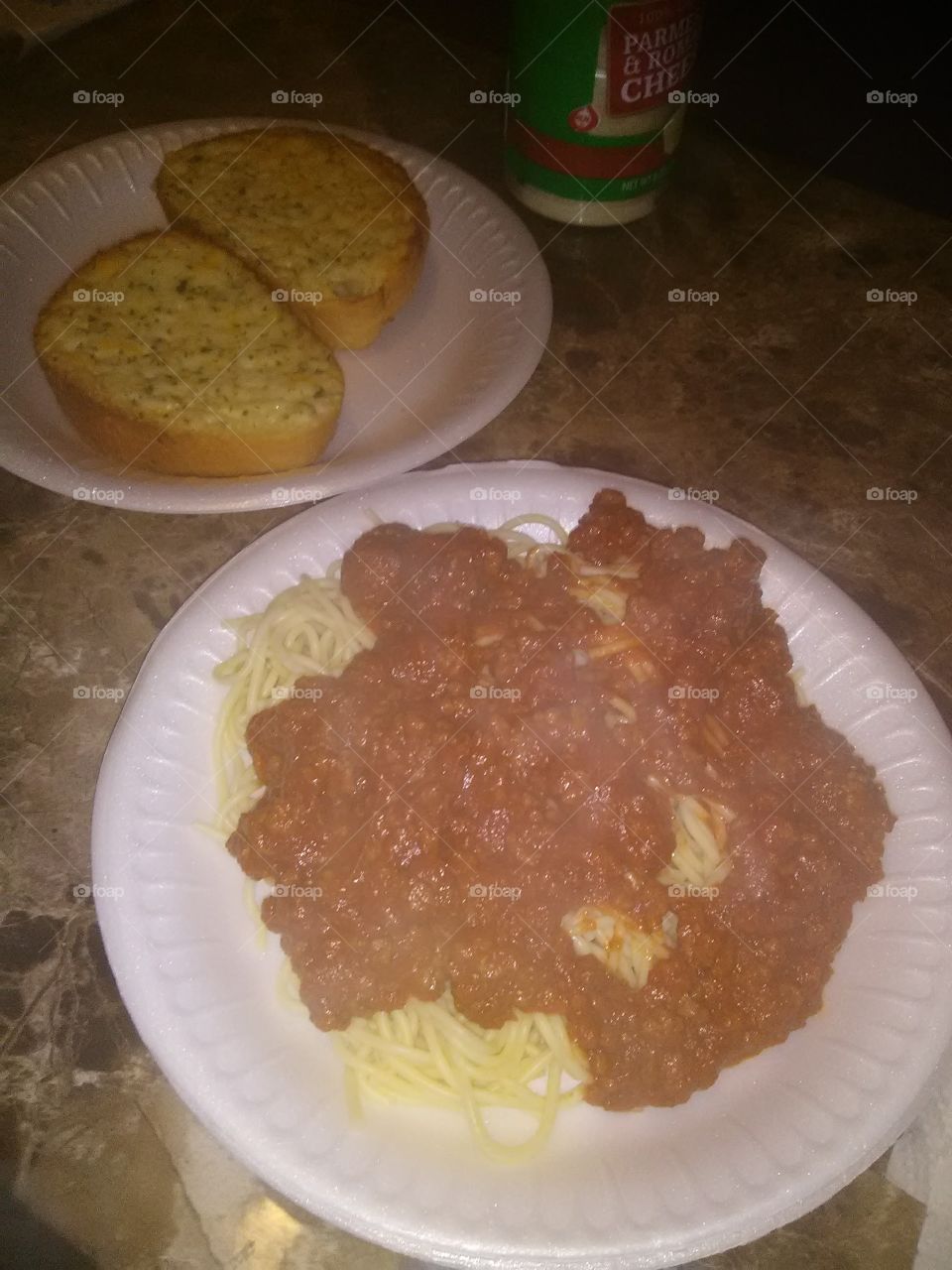 delicious spaghetti in a yummy meat sauce with Rich buttery garlic bread