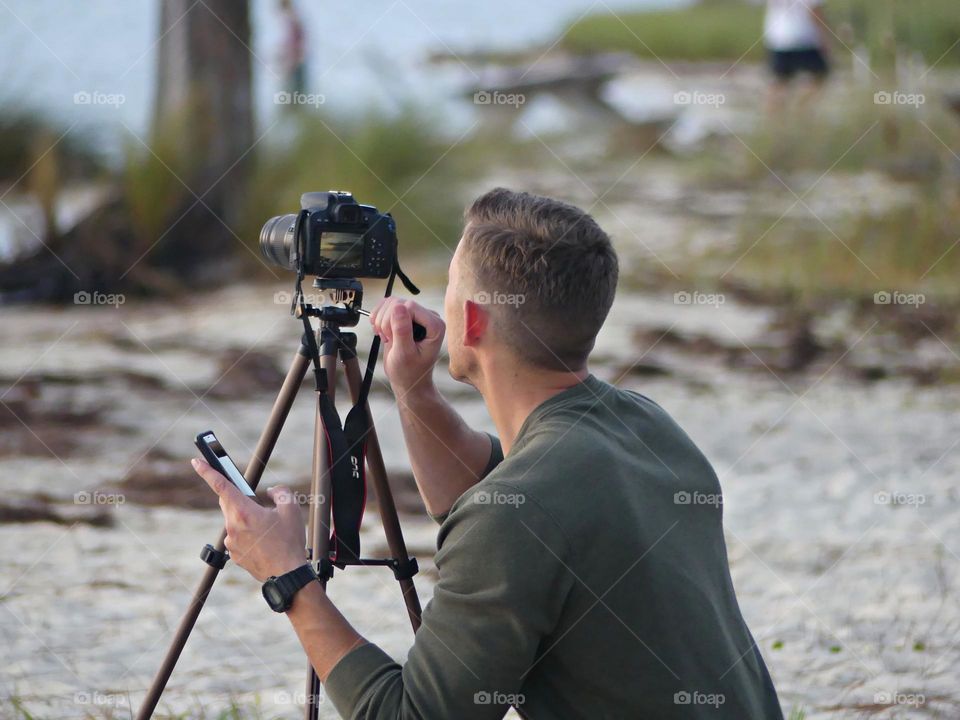 Video Creator focusing in on the sunset 