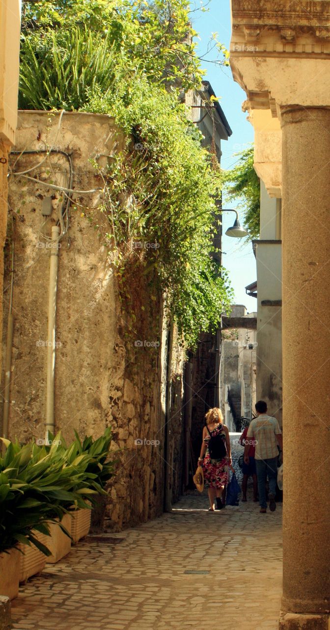 American tourists walking through alley