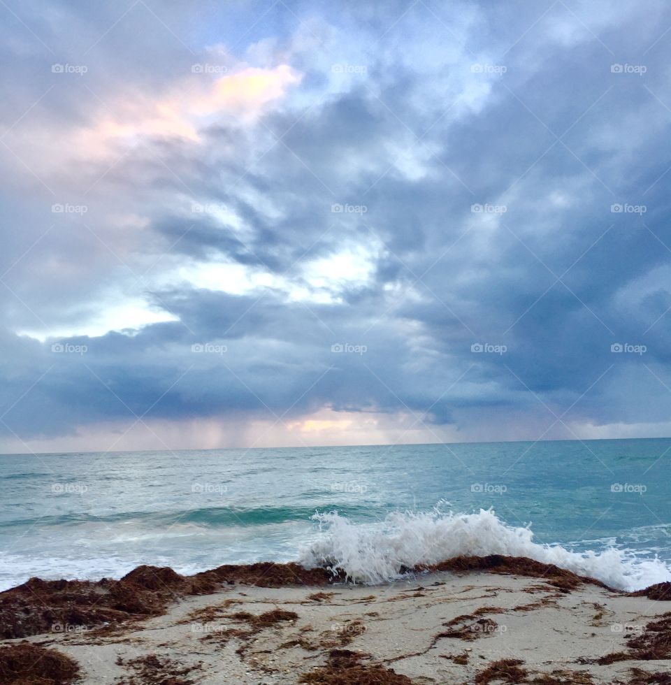 Pastel sky. Splash. Wave. Surf. Shore sunrise. Dawn. Beachside. Sand. Florida. Travel. Splendor 