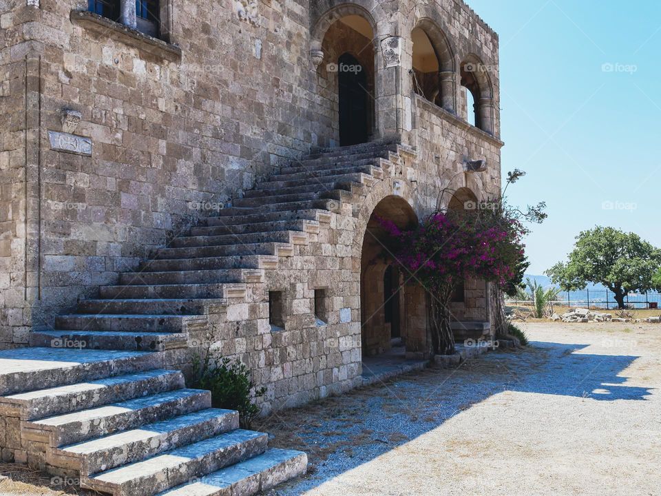 Beautiful view of the monastery of filerimos with rectangular stone stairs leading up, side view, close-up.