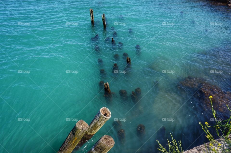 Wood in the Lake. Remnants From an Old Pier
