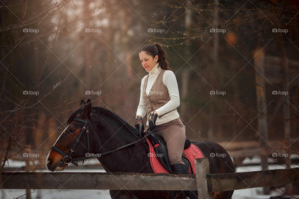 Young beautiful woman with horse outdoor portrait at spring day