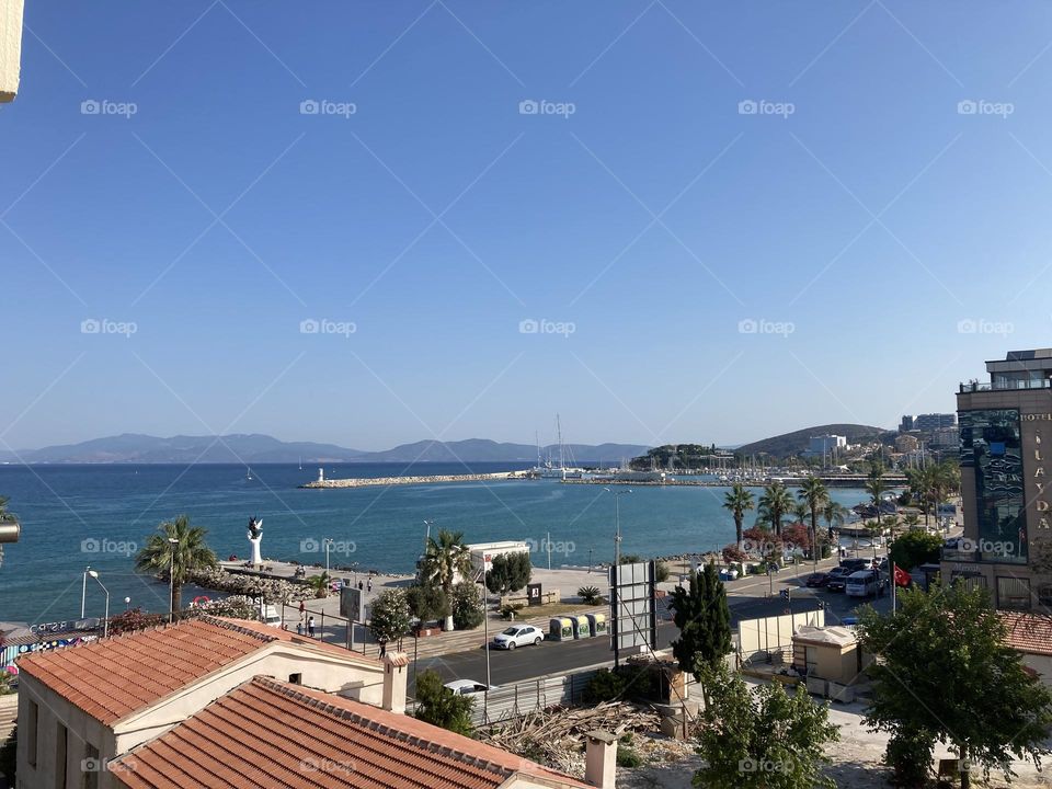 Empty streets in the sunny kusadasi Turkey. Palms and empty roads. Summertime photo. Holidays adventure.