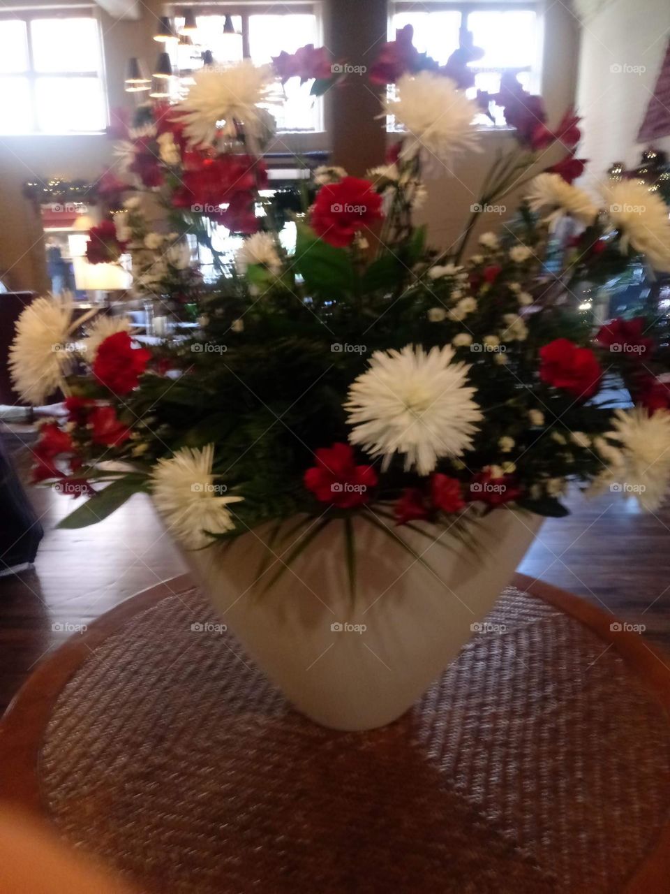 Decorative display of assorted flowers in a hotel foyer