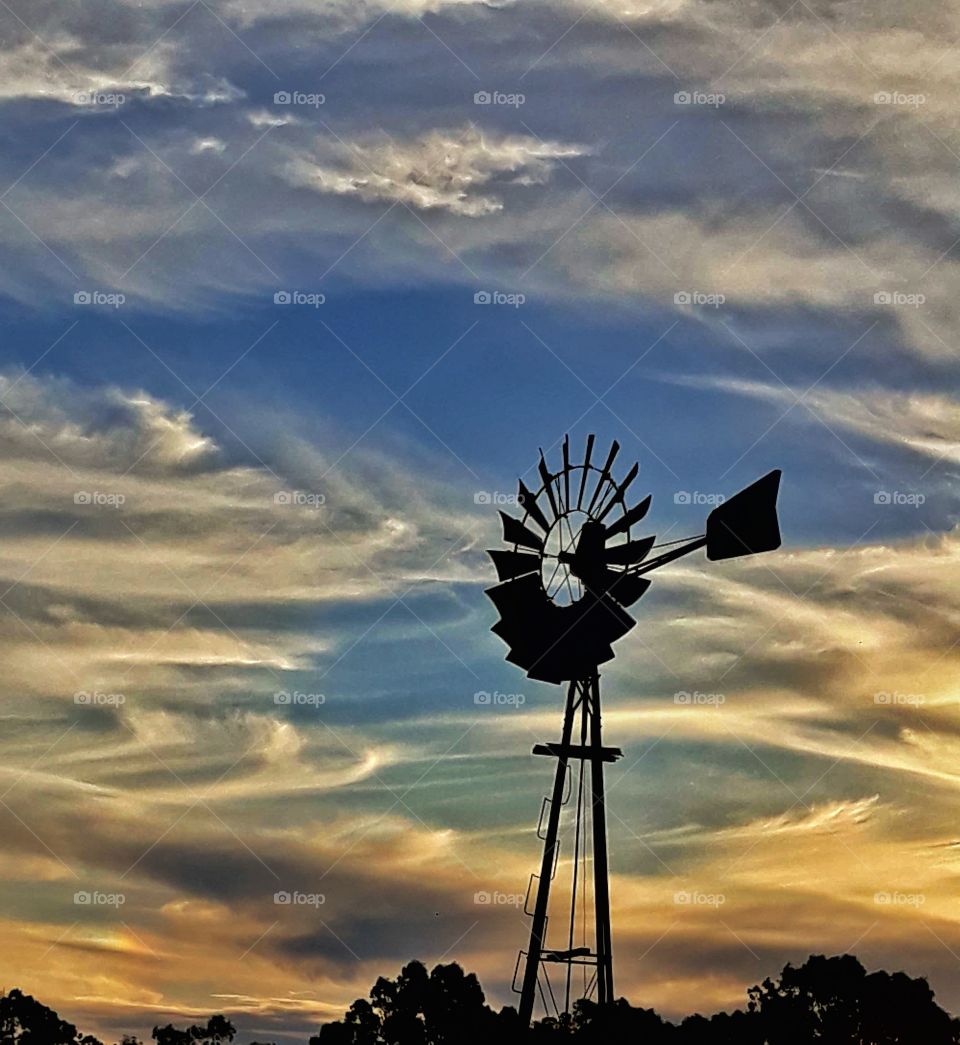 A Beautiful Sunset with a windmill