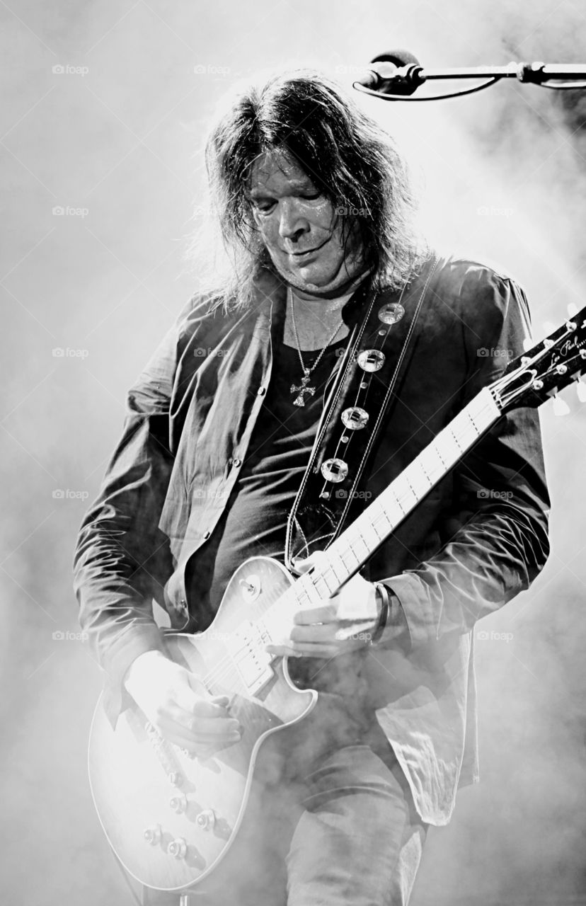 Man in concert playing guitar