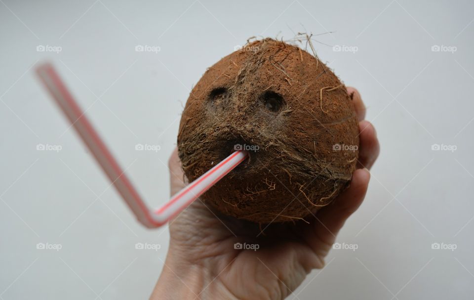 coconut cocktail in the hand white background