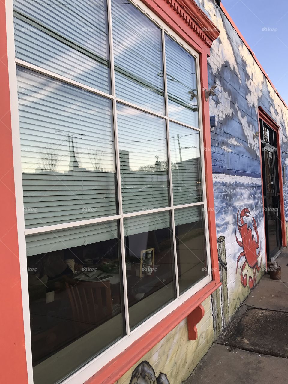 Window of painted restaurant building