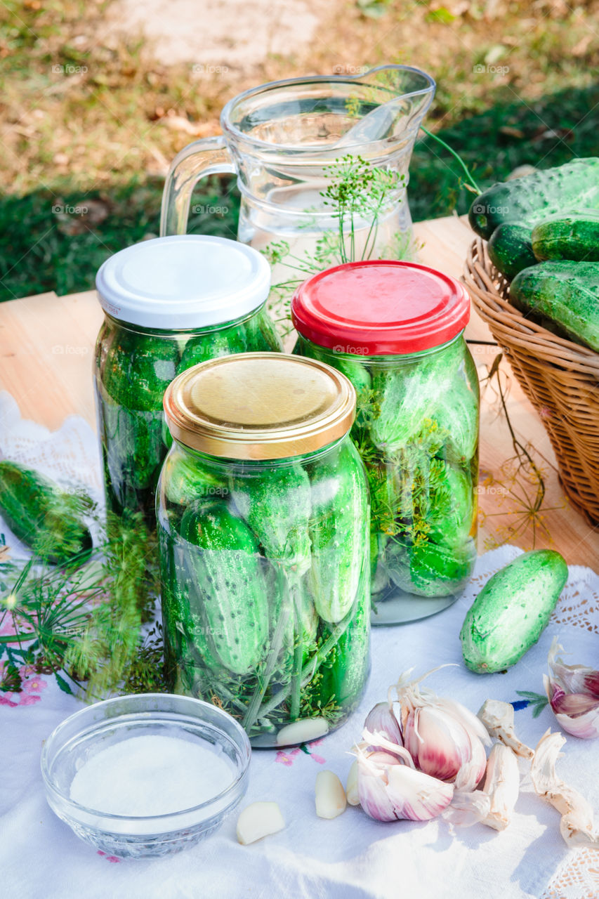 Pickling cucumbers. Pickling cucumbers with home garden vegetables and herbs